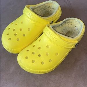 Yellow fuzzy crocs